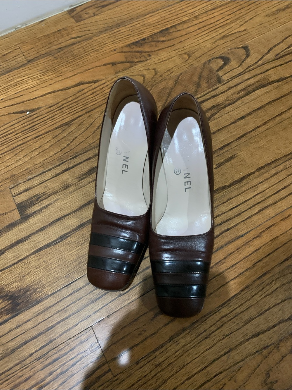 CHANEL Brown Leather Low Heel Pumps with Black Toe Stripes